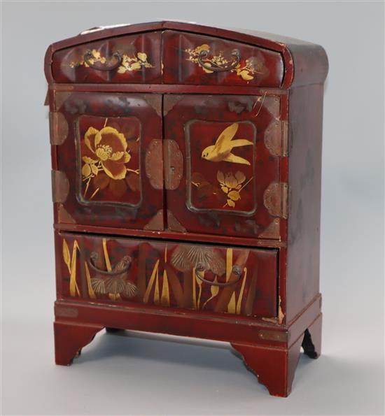 A Japanese lacquered cabinet, with key height 34cm